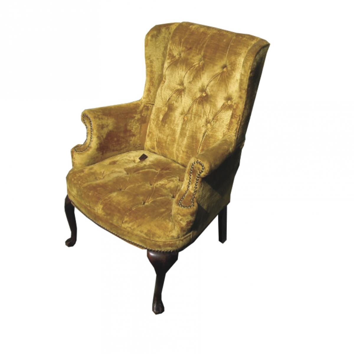 Reupholstered wing chair with tufting
